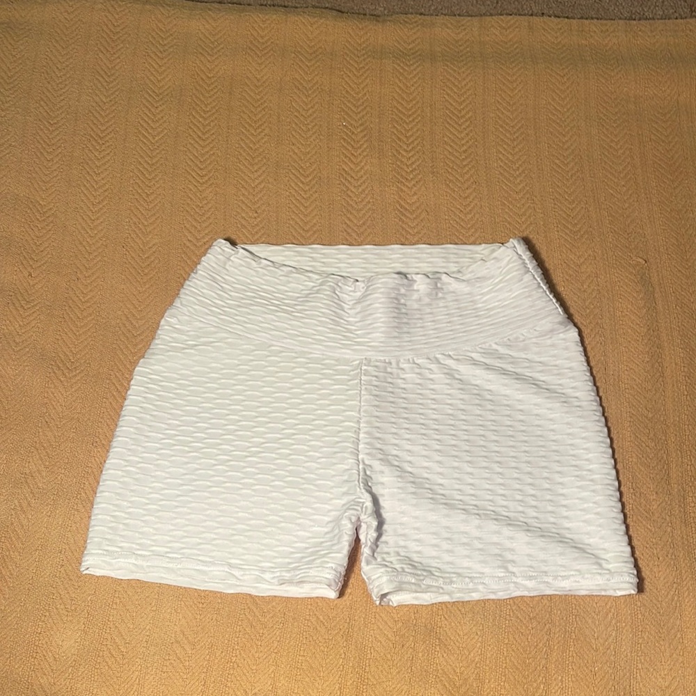 White biker shorts with textured pattern